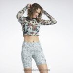 نحيف حكيم خفيف قميص شبكي بأكمام طويلة وطبعة أزهار كلاسيكية Reebok 0NZ0F750